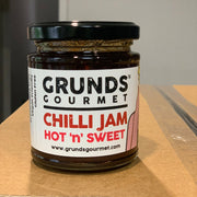 Jar of Grunds Gourmet Chilli Jam on a cardboard surface