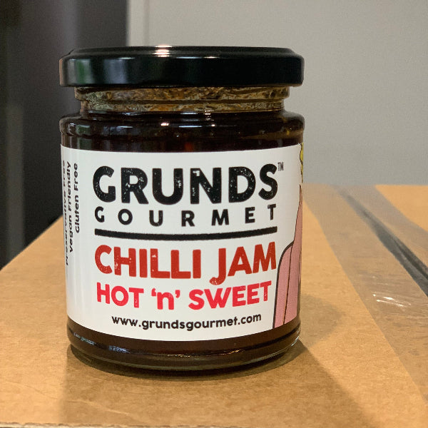 Jar of Grunds Gourmet Chilli Jam on a cardboard surface
