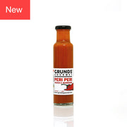 Bottle of Grunds Gourmet Peri Peri Sauce & Marinade on a white background
