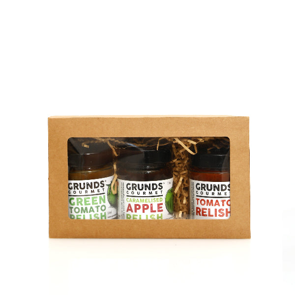 Three jars of Grunds Gourmet relish in a cardboard gift box on a white background
