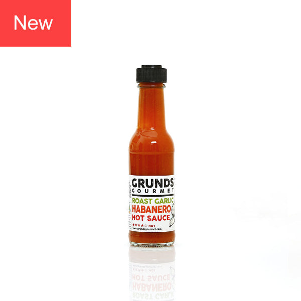 Bottle of Grunds Gourmet Roast Garlic Habanero Hot Sauce on a white background