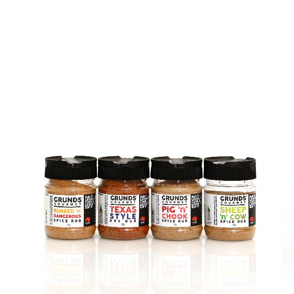 Four jars of Grunds Spice Rubs on a white background