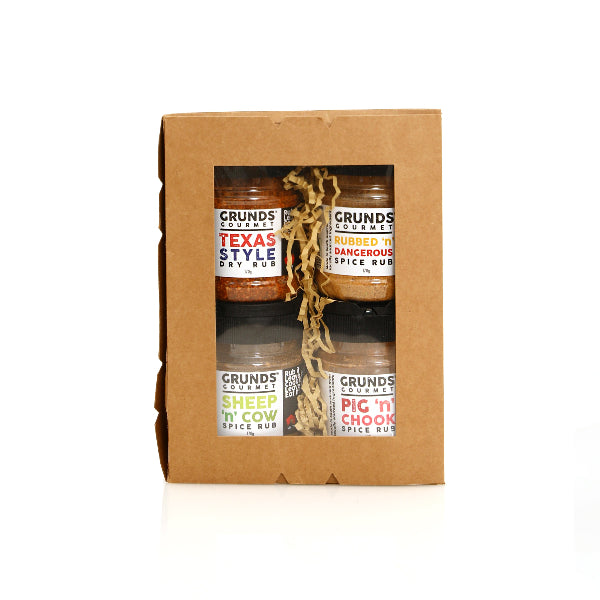 Set of Grunds Gourmet spice rubs in a cardboard box on a white background