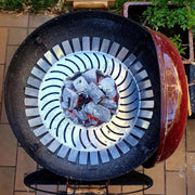 Barbecue grill with charcoal inside on a tiled patio