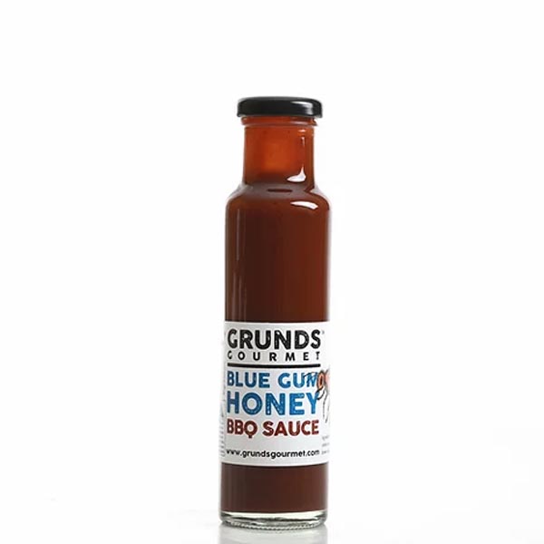 Bottle of Grunds Gourmet Blue Gum Honey BBQ Sauce on a white background