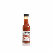 Bottle of Grundy's Gourmet Chilli Sauce on a white background