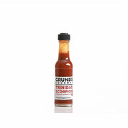 Grund's Gourmet Trinidad Scorpion hot sauce bottle on a white background