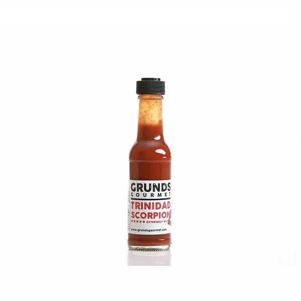 Grund's Gourmet Trinidad Scorpion hot sauce bottle on a white background