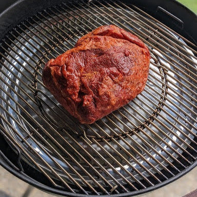 Marinated meat on a grill